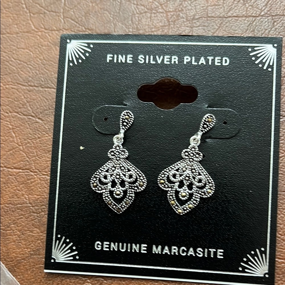 Fine Silver Plated Marcasite Dangling Earrings
Pierced ears only .